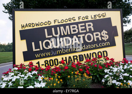 A logo sign outside of the headquarters of Lumber Liquidators, Inc., in Toano, Virginia on July 18, 2015. Stock Photo