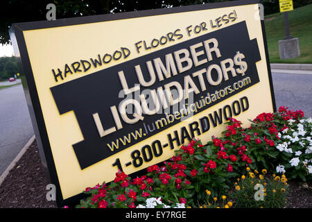 A logo sign outside of the headquarters of Lumber Liquidators, Inc., in Toano, Virginia on July 18, 2015. Stock Photo