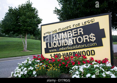 A logo sign outside of the headquarters of Lumber Liquidators, Inc., in Toano, Virginia on July 18, 2015. Stock Photo