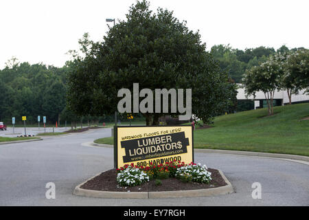 A logo sign outside of the headquarters of Lumber Liquidators, Inc., in Toano, Virginia on July 18, 2015. Stock Photo