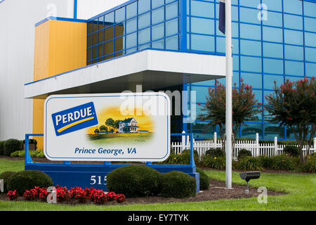 A logo sign outside of a chicken processing facility occupied by Perdue Farms, in Prince George, Virginia on July 19, 2015. Stock Photo