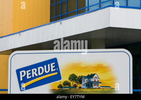 A logo sign outside of a chicken processing facility occupied by Perdue Farms, in Prince George, Virginia on July 19, 2015. Stock Photo