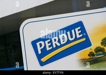 A logo sign outside of a chicken processing facility occupied by Perdue Farms, in Prince George, Virginia on July 19, 2015. Stock Photo