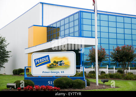 A logo sign outside of a chicken processing facility occupied by Perdue Farms, in Prince George, Virginia on July 19, 2015. Stock Photo