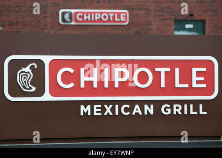 A logo sign outside of a Chipotle Mexican Grill fast casual restaurant location in Easton, Maryland on July 18, 2015. Stock Photo
