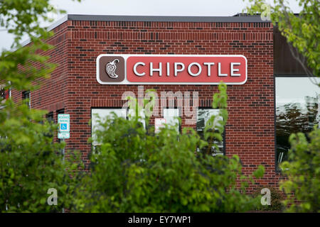 A logo sign outside of a Chipotle Mexican Grill fast casual restaurant location in Easton, Maryland on July 18, 2015. Stock Photo