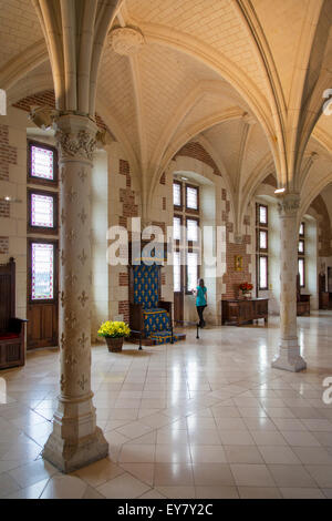 Woman looking out window of the Council Chamber - meeting room at Chateau d'Amboise, Amboise, Indre-et-Loire, Centre, France Stock Photo