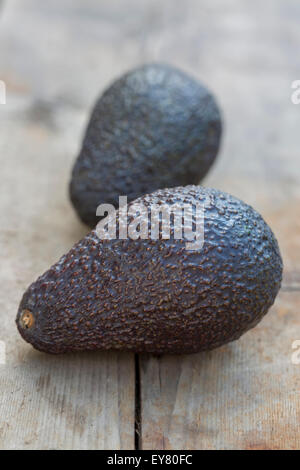 Two Avocados on rustic wooden background Stock Photo
