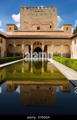 Courtyard of Myrtles pool with Comares Tower reflection in Nasrid Palaces Alhambra Granada Stock Photo