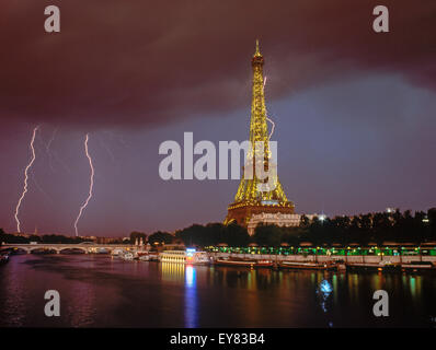 Lightning bolt and storm over Paris at night with Eiffel Tower and River Seine.  This image is not digitally enhanced.  It's real. Stock Photo