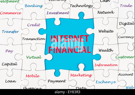 Internet Financial concept words on group of jigsaw puzzle pieces Stock Photo