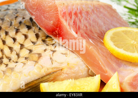 Raw carp fillets on cutting board Stock Photo