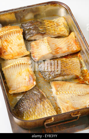 Oven baked carp fillets in baking pan Stock Photo