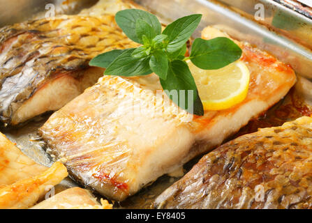 Oven baked carp fillets in baking pan Stock Photo