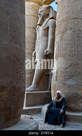 Luxor, Egypt. Temple of Luxor: a giant statue of the pharaoh Ramses II (1303-1212 b.C.) in the courtyard. Stock Photo