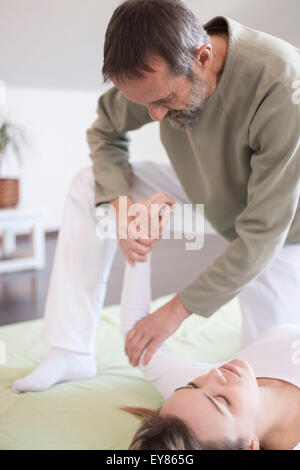 Female patient receiving Shiatsu treatment Stock Photo