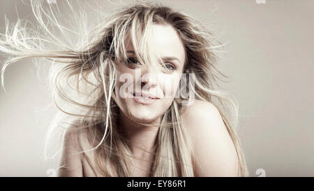 Young woman with tousled hair Stock Photo