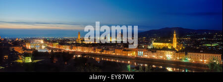 Panoramic of Florence at dusk with Vecchio Palace left Duomo center and Santa Croce Church right all above the Arno River Stock Photo