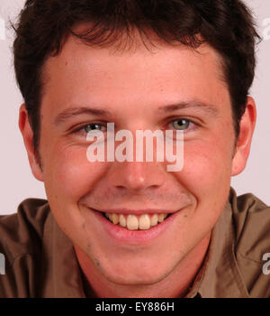 Head shot portrait of young man smiling Stock Photo