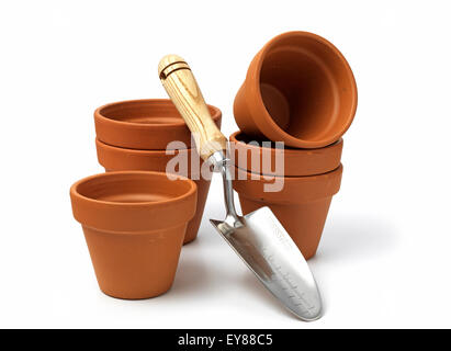 terracotta pots with a garden trowel isolated on a white background Stock Photo