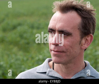 Head shot of man with receding hairline looking thoughtful Stock Photo