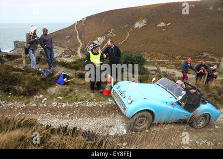 A blue Triumph  TR3A open top car takes part in a hill climb event at a clifftop location. Stock Photo