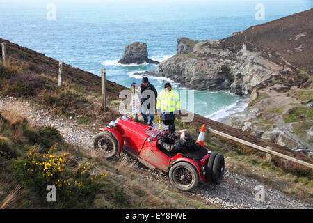 A red MG open top car takes part in a hill climb event at a clifftop location. Stock Photo