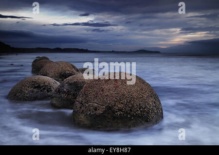 Moeraki Boulders at sunrise, South Island, New Zealand Stock Photo