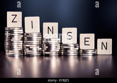 Stack of coins and the word interest. Stock Photo