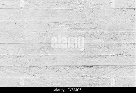 White concrete wall background texture with horizontal relief pattern Stock Photo