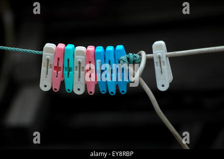 Plastic clothesline clamps. Stock Photo