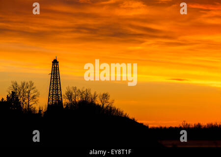 Silhouette,Sunrise,Dawn,Canada,Drilling Rig Stock Photo