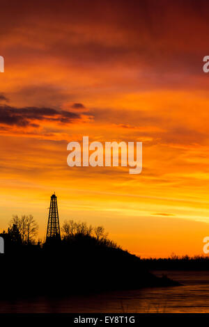 Silhouette,Sunrise,Dawn,Canada,Drilling Rig Stock Photo