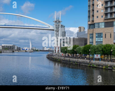 Manchester ship canal at Salford Quays with the bridge lifted up to allow a ship to pass underneath. Stock Photo