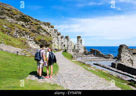 Tourists at the ruins of Tintagel Castle, a site linked with the legend of King Arthur, Cornwall, England, UK Stock Photo