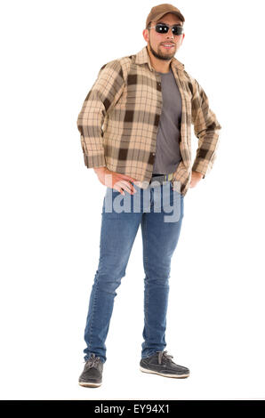 latin man in flannel shirt cap and sunglasses standing fullbody Stock Photo