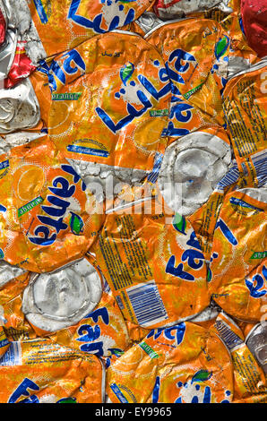 Preston, England. Close up on crushed Fanta orange drink tin cans waiting recycling.  Photo- Becky Matthews Stock Photo