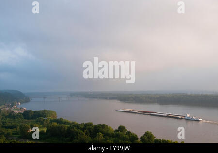 Agriculture - Grain barge navigating the Mississippi River early on an ...