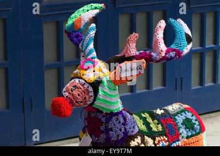 Decorated wire-framed deer, 'Yarn Bombed' & covered with crocheted wool squares of various colours of wool. Blackpool, UK Stock Photo