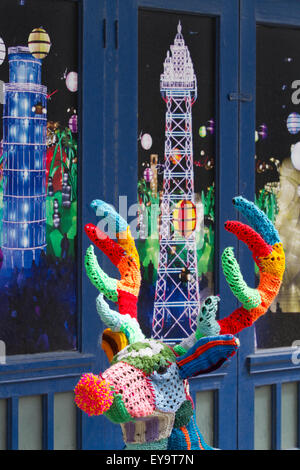 Decorated wire-framed deer, 'Yarn Bombed' & covered with crocheted wool squares of various colours of wool. Blackpool, UK Stock Photo