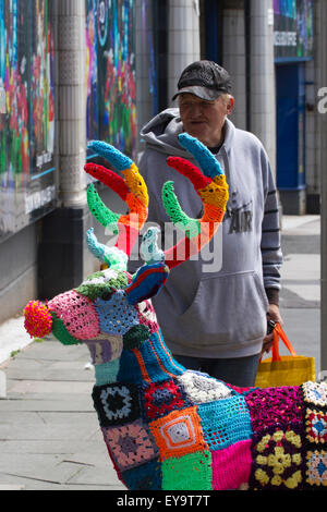 Decorated wire-framed deer, 'Yarn Bombed' & covered with crocheted wool squares of various colours of wool. Blackpool, UK Stock Photo