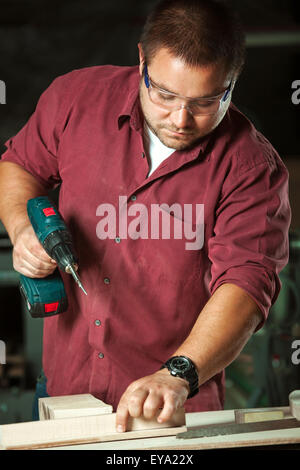 This is photo of professional carpenter at work. Stock Photo
