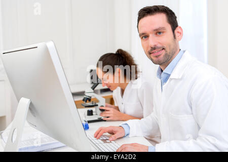 View of Scientists working together in a laboratory Stock Photo