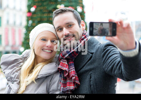 View of a Young couple on holidays taking selfie Stock Photo