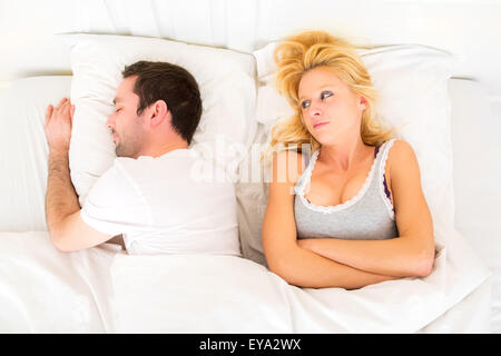 View of a Young attractive pensive woman in a bed Stock Photo