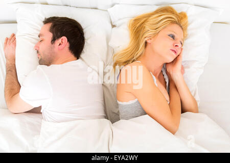 View of a Young attractive pensive woman in a bed Stock Photo
