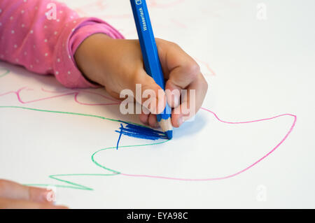 Berlin, Germany, painting a child's hand in Kita Stock Photo
