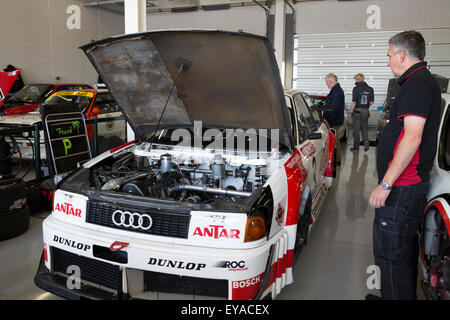 Silverstone, UK,25th July 2015, Audi engine being worked on in the pitts at Silverstone Classic 2015 The worlds biggest classic motor racing festiva Credit: Keith Larby/17�Թ����� Live News Stock Photo