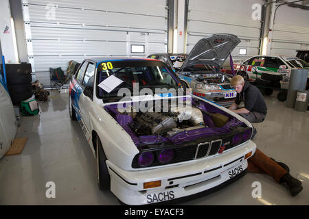 Silverstone, UK,25th July 2015, MK3 engine being worked on in the pitts at Silverstone Classic 2015 The worlds biggest classic motor racing festiva Credit: Keith Larby/17�Թ����� Live News Stock Photo