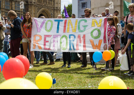 London, UK. 25th July, 2015. Protesters gather outside the Houses of Parliament to demand electoral reform, including proportional representation rather than the first-past-the-post method that saw the Tories gain a majority. Credit:  Paul Davey/Alamy Live News Stock Photo